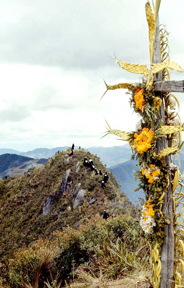 Saraguros decorate the cross on Mt. Puglla on Holy Cross day, 1971